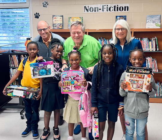 Ted Hoskinson, CEO of Roots and Wings, with students